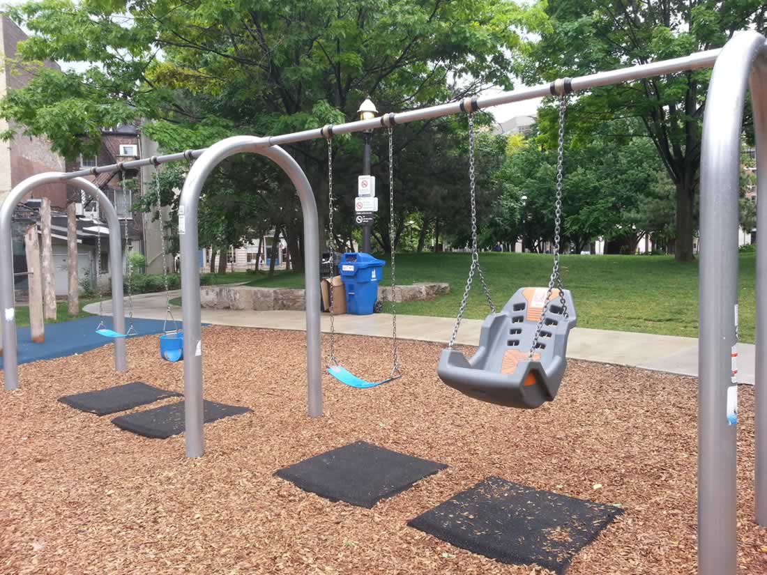 Swings at St. James Park playground in Toronto