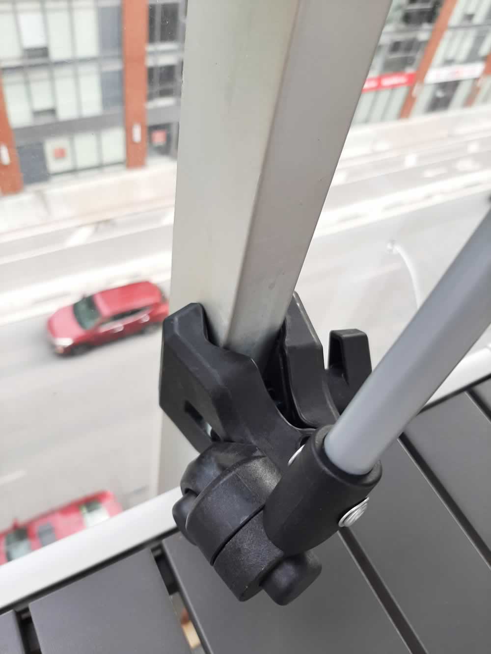 Versa-Brella clamp on balcony rail.