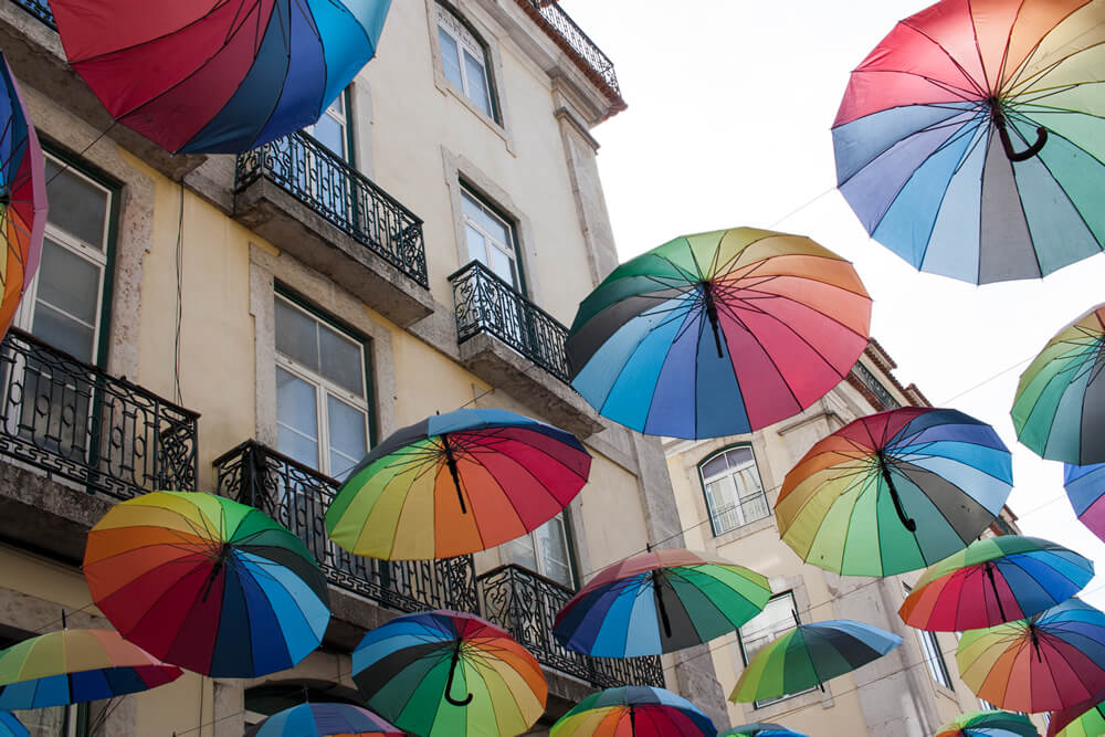 Colourful umbrellas on Pink Street in Lisbon.