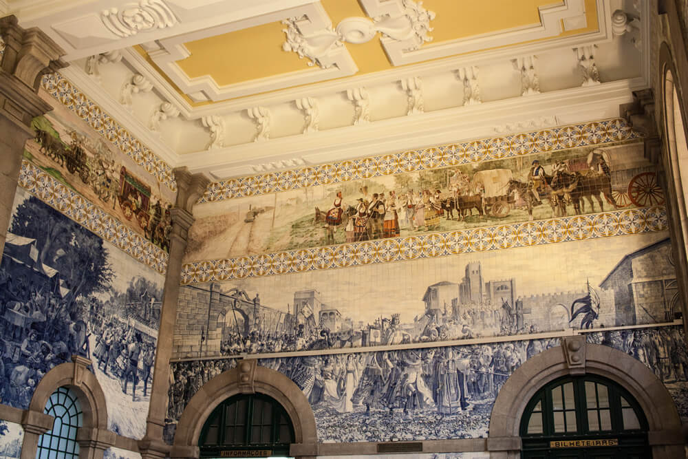 Tiled walls inside Sao Bento train station in Porto, Portugal