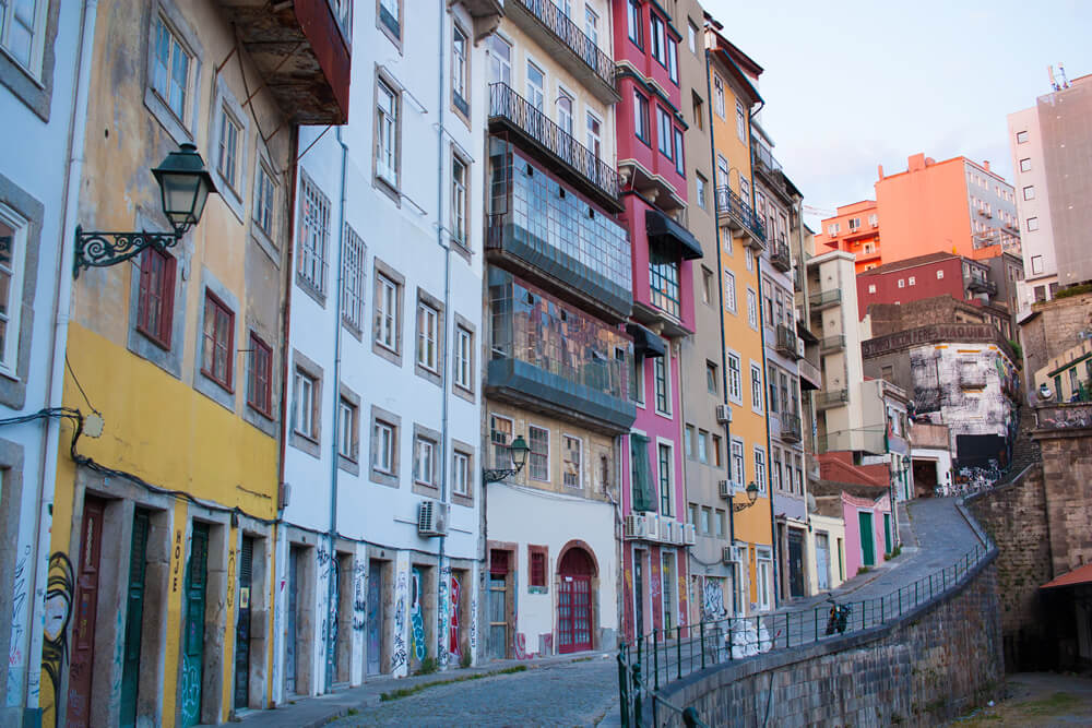 Narrow street beside São Bento railway station in Porto.