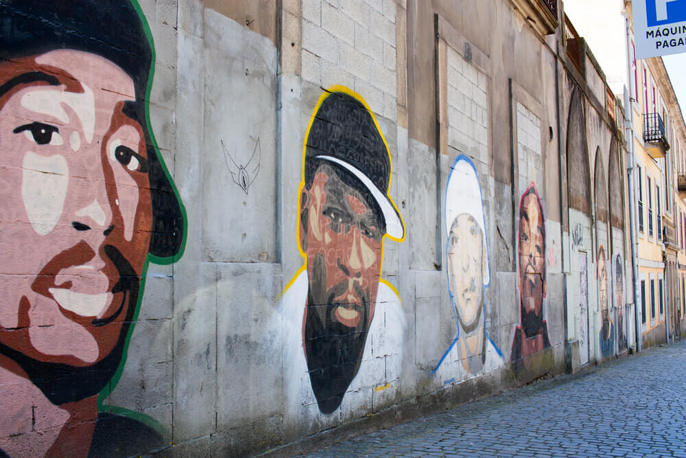 Rapper murals along Rua da Restauração in Porto.