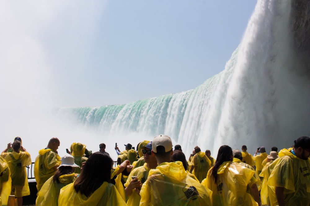 Tourists view the Horseshoe Falls from below, as part of the Journey Behind the Falls in Niagara Falls, Canada.