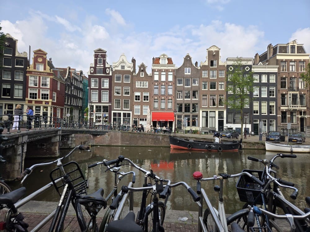 Singel canal in Amsterdam - with bicycles in the forefront.