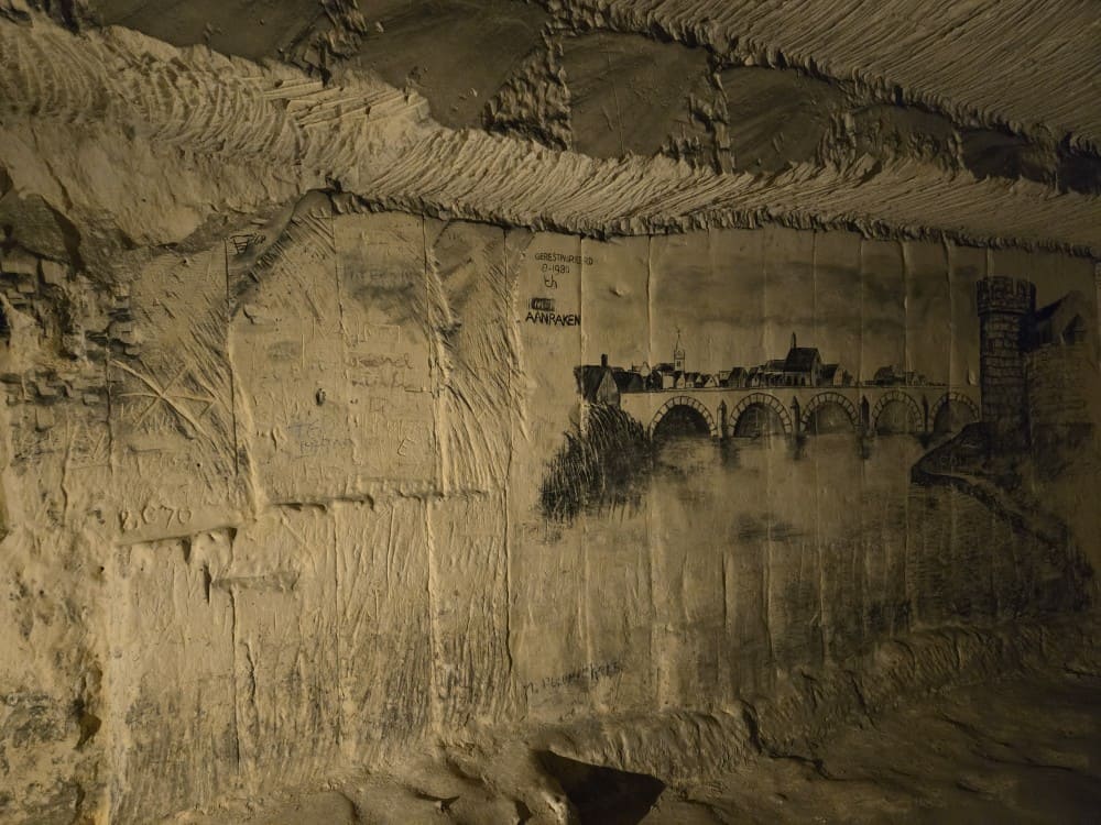 Wall art during the North Caves tour in Maastricht, Netherlands