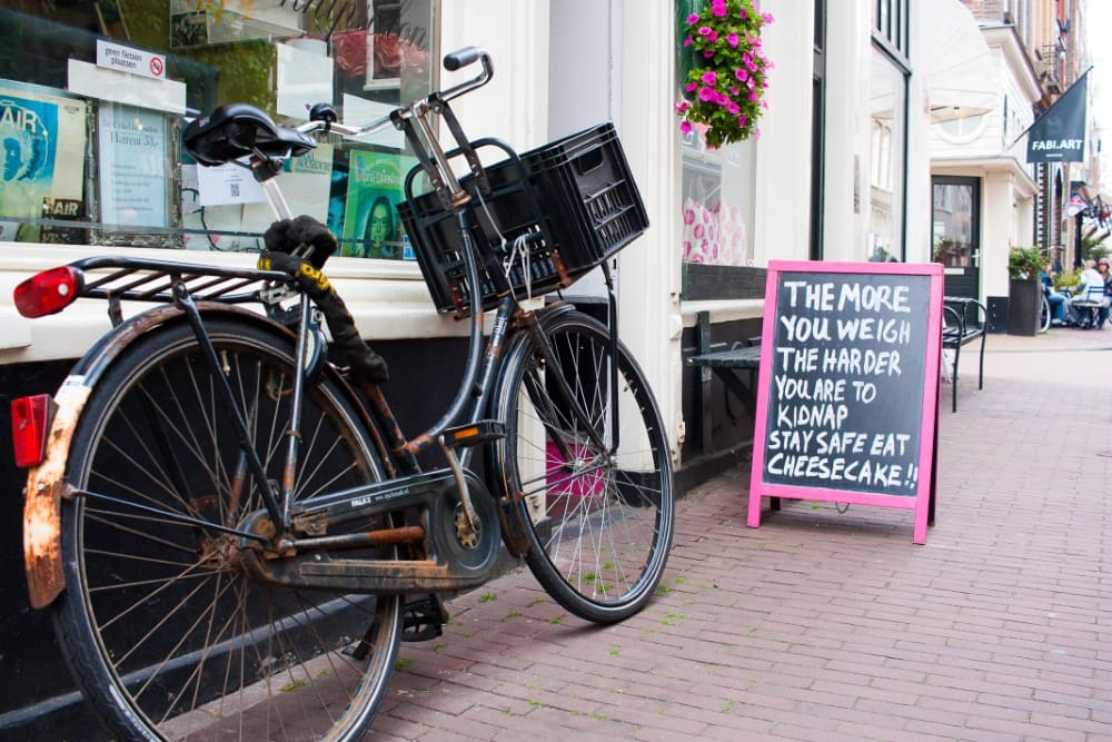 Bicycle and shop sign in Joordan - Amsterdam.