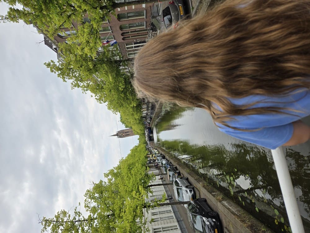 Girl overlooking canal in Delft, Netherlands.