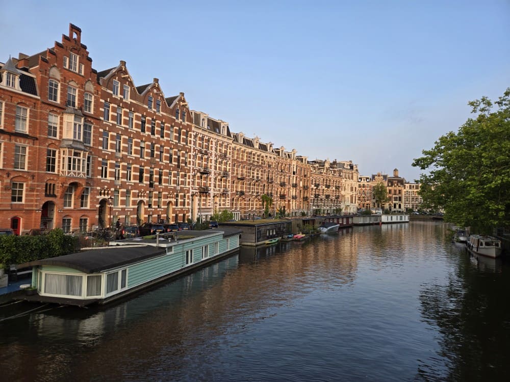 Canal houseboats near Foodhallen in Amsterdam.